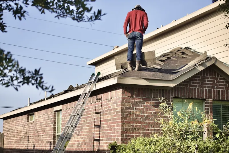 Professional roofer working on a residential roof in Hollywood Hills